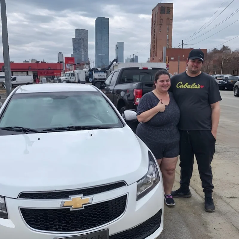 Carlos & Maria with their approved White Sedan