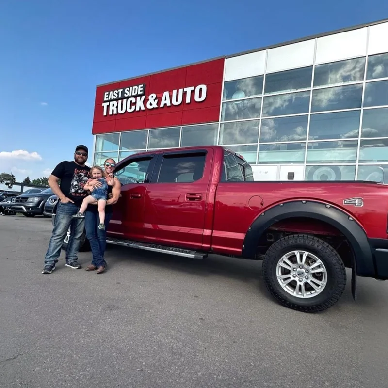 The Thompson Family with their approved Red F-150 Pickup Truck